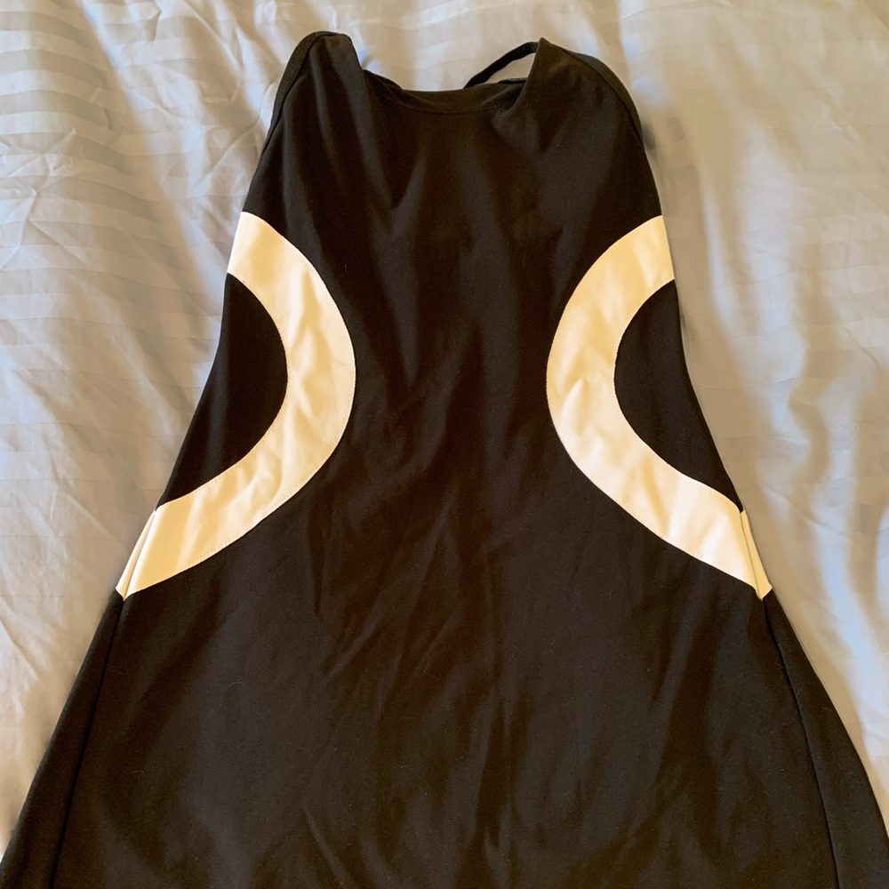 Fun tennis dress- light material. No shorts. Has light bra support built in.